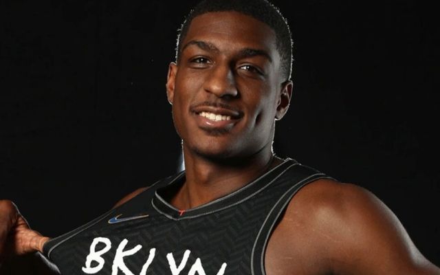 Reggie Perry wearing nets black uniform