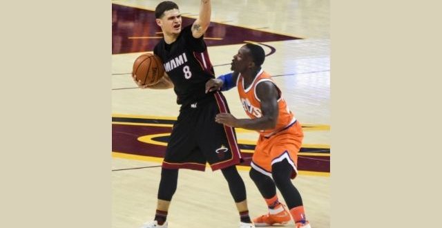 Tyler Johnson holding the ball