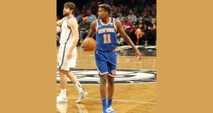 Frank Ntilikina wearing blue uniform