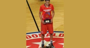 Justin Jackson holding Award