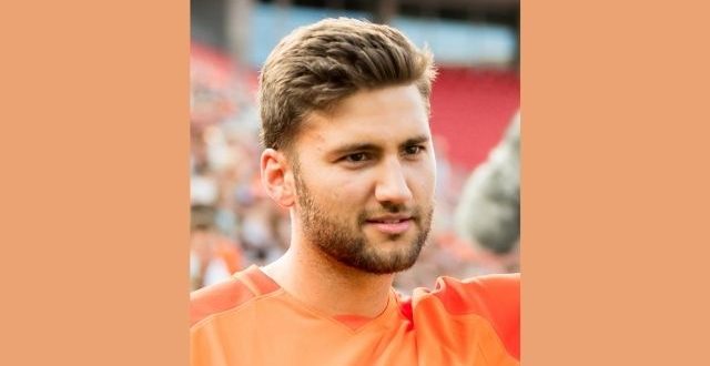 Maximilian_Kleber_ wearing orange t-shirt